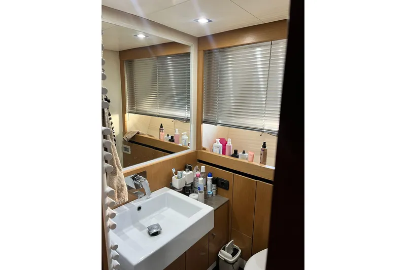  Yacht Photos Pics Luxurious bathroom in 2011 Cayman Yachts 60 HT with modern fixtures and ample storage.