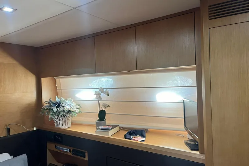  Yacht Photos Pics Luxurious interior of 2011 Cayman Yachts 60 HT with elegant wood paneling and decor.