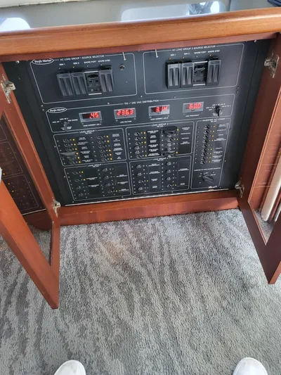 Layed Back Yacht Photos Pics Control panel of a 2005 Pacific Mariner 65 SE Motoryacht with switches and indicators.