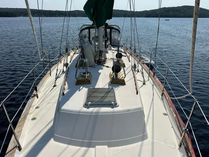 Lagniappe Yacht Photos Pics Sailing yacht Pacific Seacraft Crealock 44, 1990 model, on calm waters.
