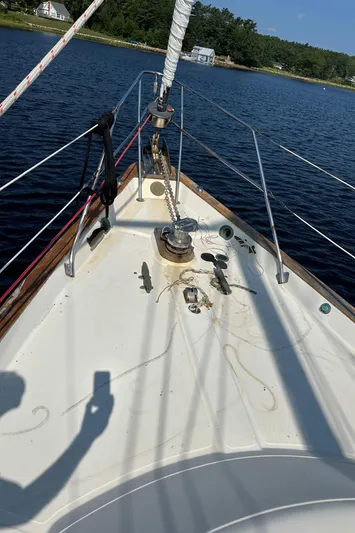 Lagniappe Yacht Photos Pics Sailing on a 1990 Pacific Seacraft Crealock 44, calm waters, sunny day.