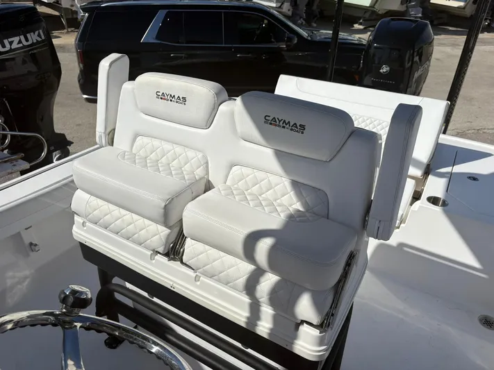  Yacht Photos Pics 2023 Caymas 28 HB boat with luxurious white seating and steering wheel.