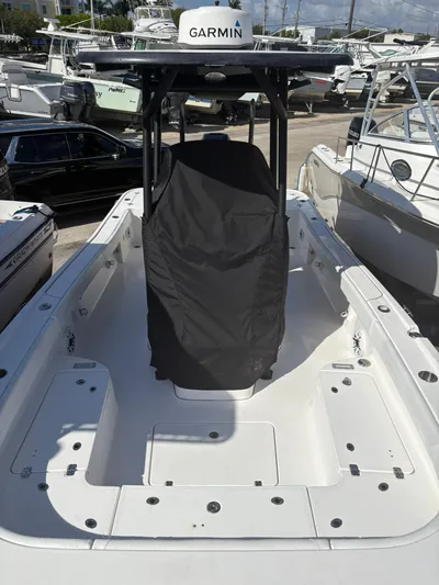  Yacht Photos Pics 2023 Caymas 28 HB boat with Garmin equipment, docked among other vessels.