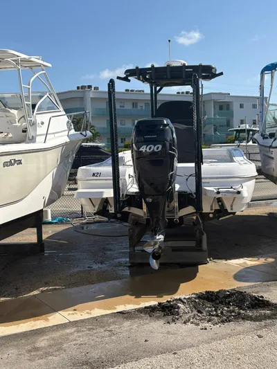  Yacht Photos Pics 2023 Caymas 28 HB boat with 400 horsepower engine, docked in a marina.