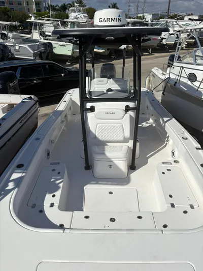  Yacht Photos Pics 2023 Caymas 28 HB boat with Garmin equipment, docked among other vessels.