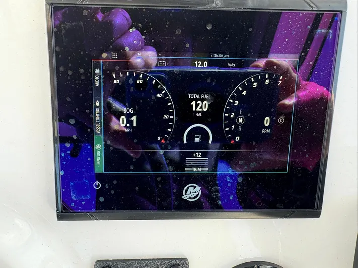  Yacht Photos Pics Dashboard display of a 2023 Caymas 28 HB boat showing speed, fuel, and RPM.