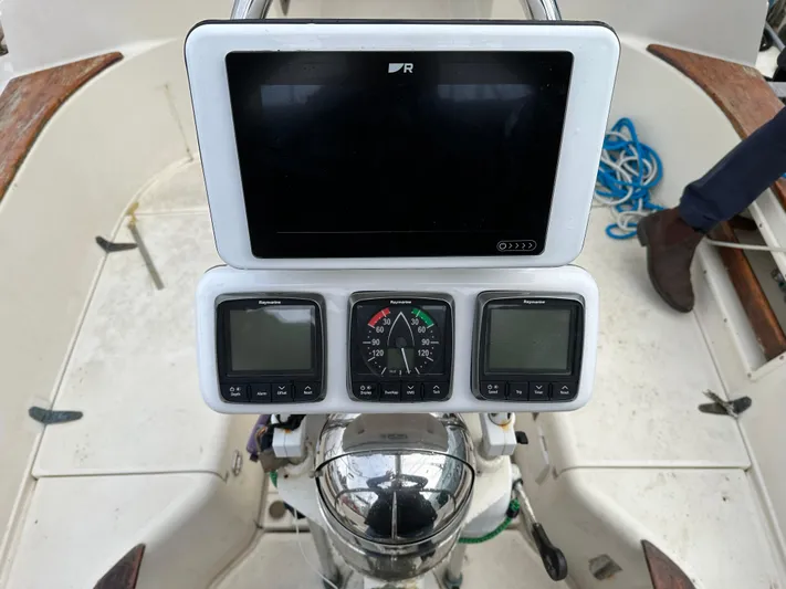 Lagniappe Yacht Photos Pics Cockpit of 1990 Pacific Seacraft Crealock 44 with navigation instruments and steering wheel.