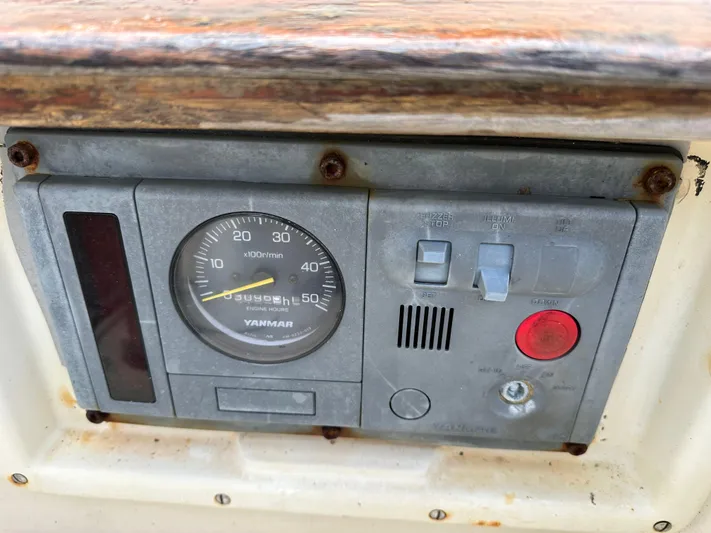 Lagniappe Yacht Photos Pics Control panel of a 1990 Pacific Seacraft Crealock 44 sailboat with Yanmar gauge.