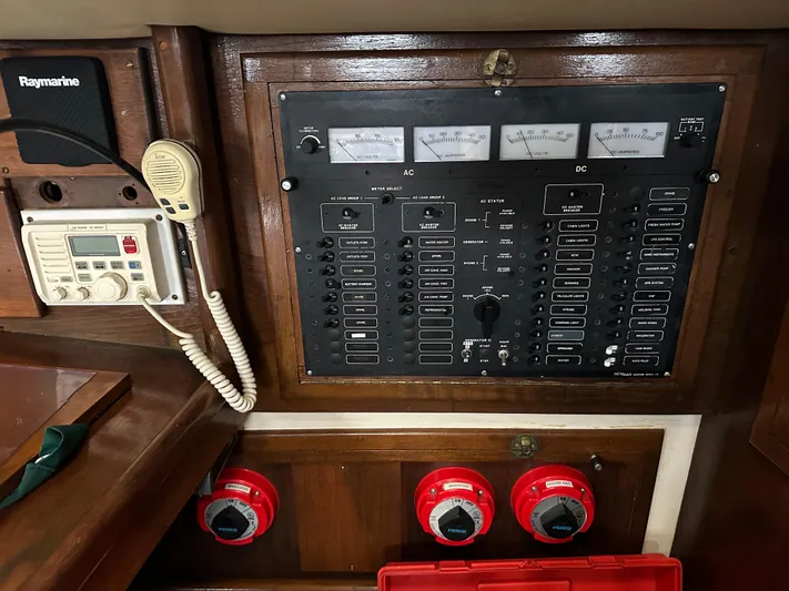 Lagniappe Yacht Photos Pics Control panel of a 1990 Pacific Seacraft Crealock 44 sailboat with navigation equipment.