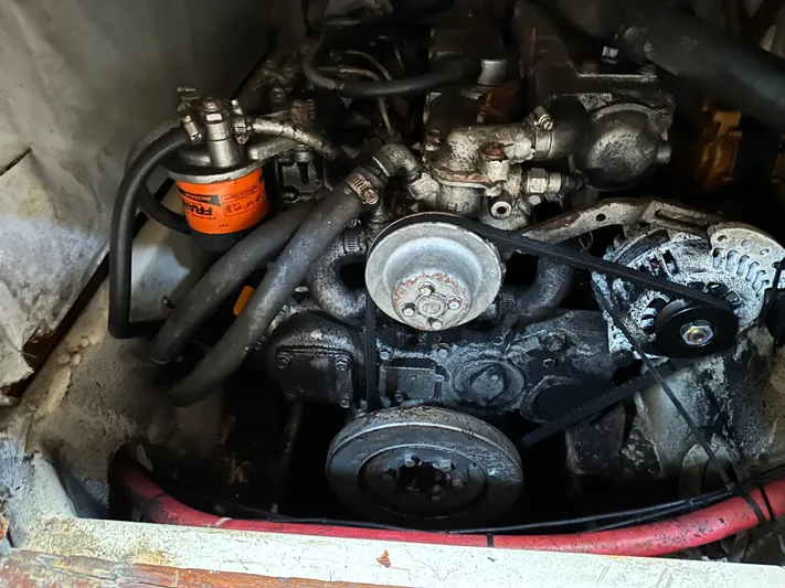 Lagniappe Yacht Photos Pics Engine compartment of a 1990 Pacific Seacraft Crealock 44 sailboat, showing mechanical components.