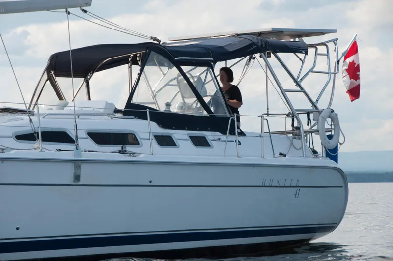 Inspiration VI Yacht Photos Pics Sailing yacht Hunter 41, 2006 model, with Canadian flag on calm waters.