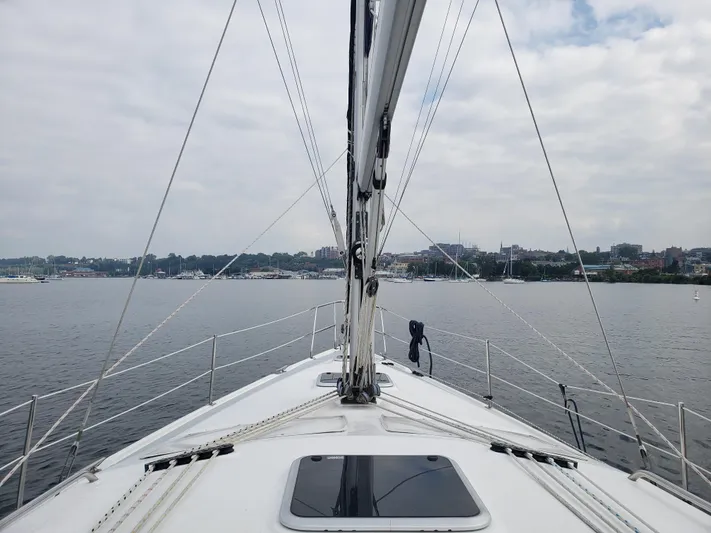 Inspiration VI Yacht Photos Pics Sailing on a 2006 Hunter 41 yacht, view of the bow and calm waters.