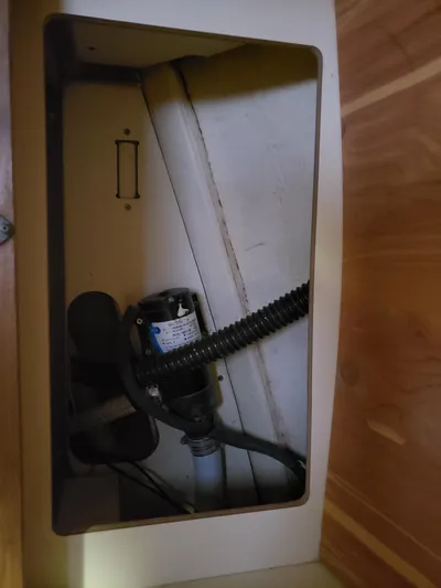 Inspiration VI Yacht Photos Pics Bilge pump inside a 2006 Hunter 41 sailboat compartment.