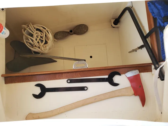 Inspiration VI Yacht Photos Pics Storage compartment with tools and rope on a 2006 Hunter 41 boat.