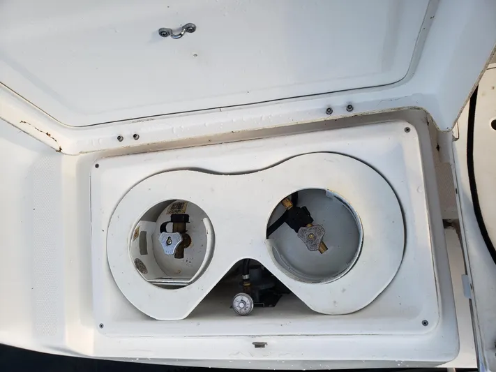 Inspiration VI Yacht Photos Pics Compartment on a 2006 Hunter 41 boat, featuring dual circular openings.