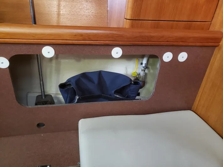 Inspiration VI Yacht Photos Pics Interior view of a 2006 Hunter 41 sailboat, featuring a storage compartment.