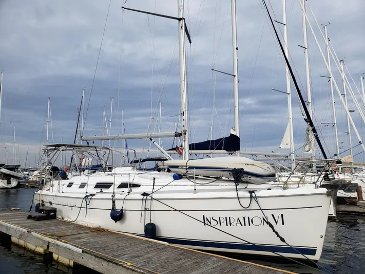 Inspiration VI Yacht Photos Pics 2006 Hunter 41 sailboat docked, named "Inspiration VI," with overcast sky background.