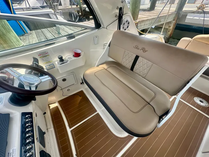  Yacht Photos Pics 2012 Sea Ray 310 Sundancer helm with tan seating and wood accents.