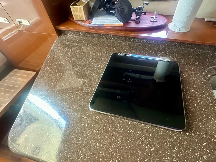  Yacht Photos Pics Luxurious interior of 2012 Sea Ray 310 Sundancer with sleek countertop and modern appliances.