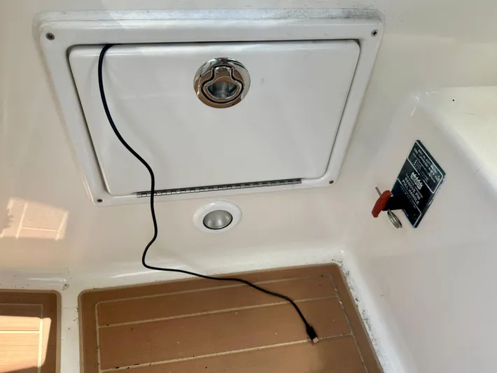  Yacht Photos Pics 2012 Sea Ray 310 Sundancer boat compartment with cable and control panel.