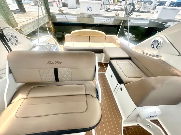  Yacht Photos Pics Luxurious interior of 2012 Sea Ray 310 Sundancer yacht with beige seating.