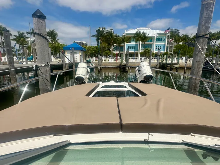 Yacht Photos Pics 2012 Sea Ray 310 Sundancer docked at marina with scenic waterfront view.