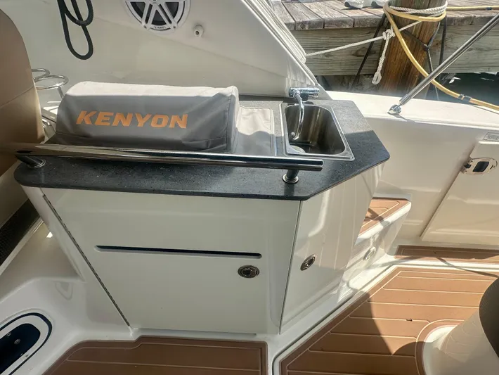  Yacht Photos Pics Outdoor kitchenette on 2012 Sea Ray 310 Sundancer boat with Kenyon grill.
