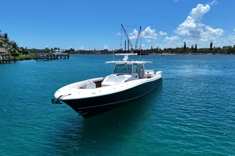  Yacht Photos Pics 2020 HCB 53 Sueños boat on clear blue water under a sunny sky.