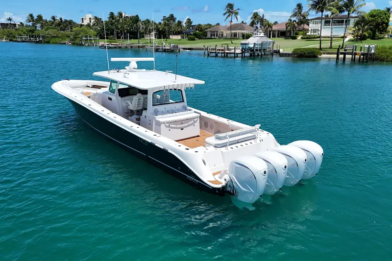  Yacht Photos Pics 2020 HCB 53 Sueños boat with four engines on turquoise water.