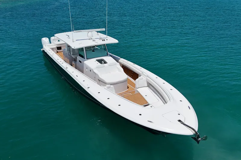  Yacht Photos Pics 2020 HCB 53 Sueños boat on clear blue water, showcasing sleek design and spacious deck.