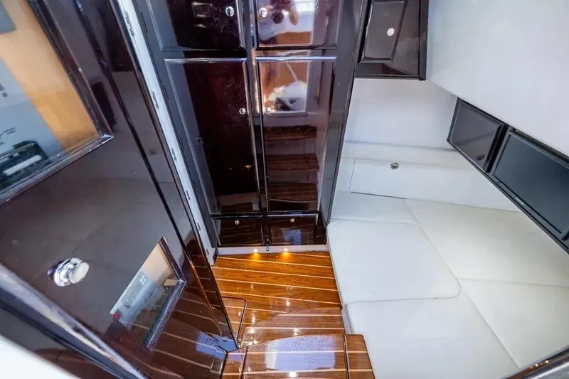  Yacht Photos Pics Luxurious interior of 2020 HCB 53 Sueños yacht with sleek cabinetry and seating.
