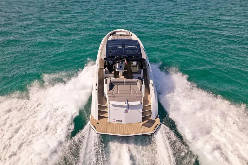 The Next Trade Yacht Photos Pics Vanquish Yachts VQ58 2022 cruising on open water, showcasing sleek design and powerful performance.
