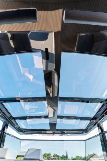 The Next Trade Yacht Photos Pics 2022 Vanquish Yachts VQ58 glass roof showcasing sleek, modern design.