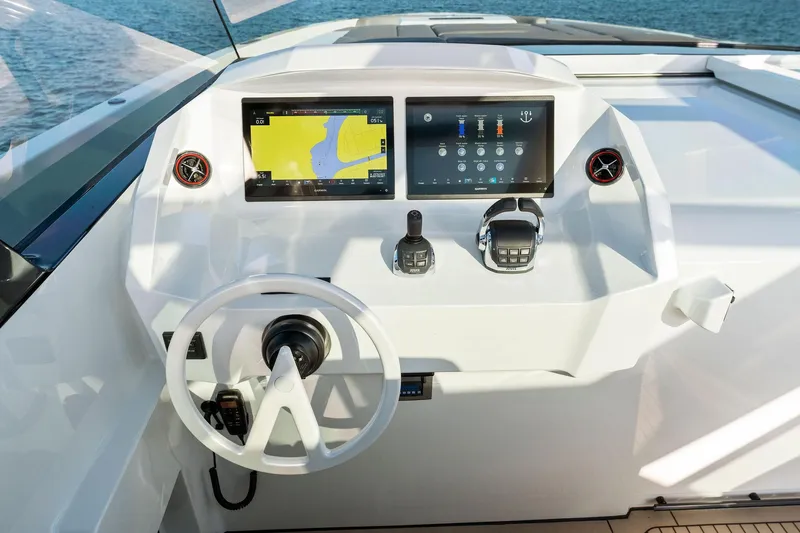 The Next Trade Yacht Photos Pics Helm of 2022 Vanquish Yachts VQ58 with modern navigation displays and controls.