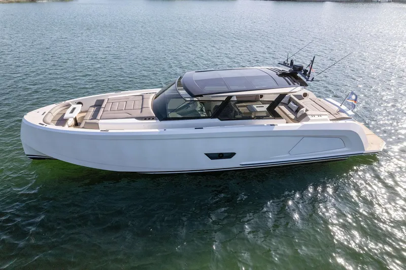 The Next Trade Yacht Photos Pics 2022 Vanquish Yachts VQ58 luxury yacht on calm water.