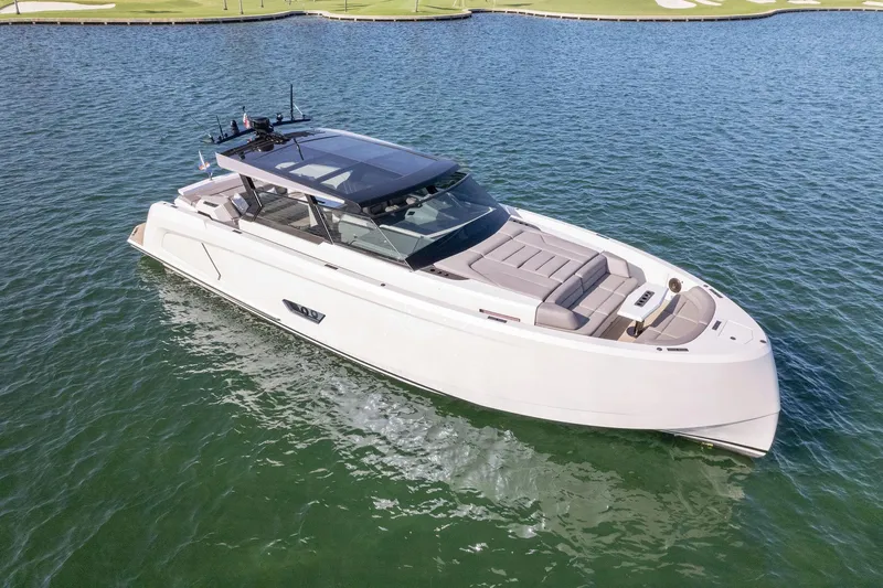 The Next Trade Yacht Photos Pics 2022 Vanquish Yachts VQ58 luxury yacht on calm water.