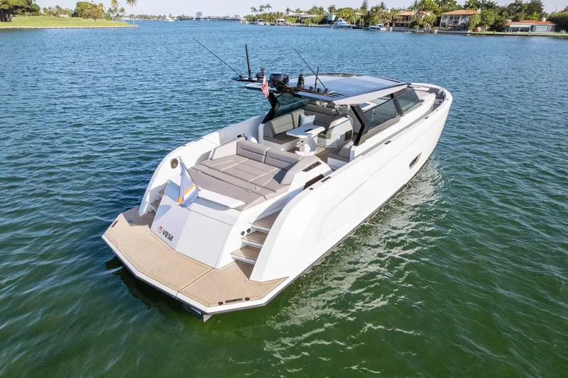 The Next Trade Yacht Photos Pics Vanquish Yachts VQ58 2022 model cruising on serene waters, showcasing luxury design.
