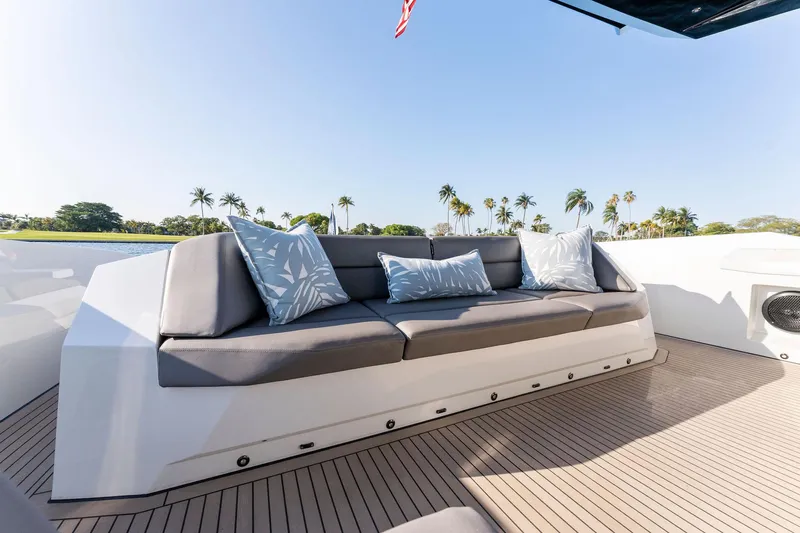 The Next Trade Yacht Photos Pics Luxurious seating on 2022 Vanquish Yachts VQ58, featuring elegant cushions and sleek design.