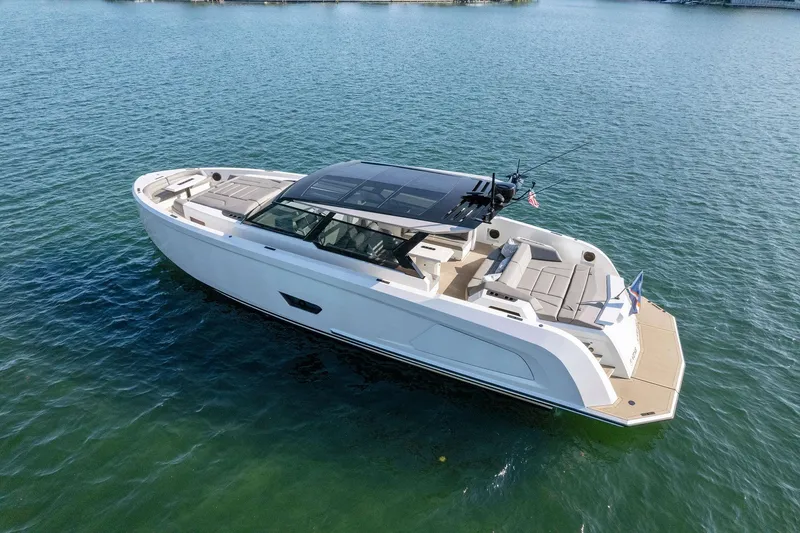 The Next Trade Yacht Photos Pics Vanquish Yachts VQ58 2022 model, sleek design, cruising on calm waters.