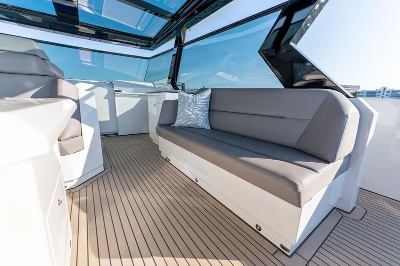 The Next Trade Yacht Photos Pics Luxurious interior of 2022 Vanquish Yachts VQ58 with sleek seating and modern design.