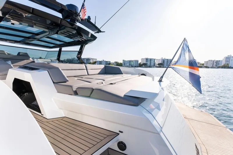 The Next Trade Yacht Photos Pics 2022 Vanquish Yachts VQ58 luxury yacht on water, featuring sleek design and modern amenities.