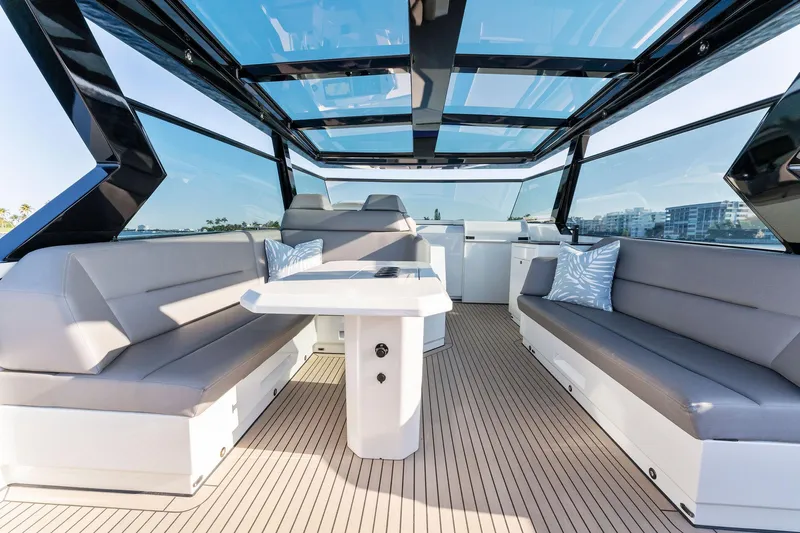The Next Trade Yacht Photos Pics Luxurious 2022 Vanquish Yachts VQ58 interior with sleek seating and modern design.