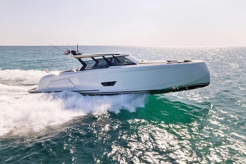 The Next Trade Yacht Photos Pics 2022 Vanquish Yachts VQ58 cruising on open water, showcasing sleek design and performance.