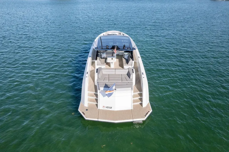 The Next Trade Yacht Photos Pics Vanquish Yachts VQ58 2022 model on calm water, aerial view.