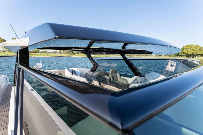 The Next Trade Yacht Photos Pics 2022 Vanquish Yachts VQ58 luxury yacht with sleek design on a sunny day.