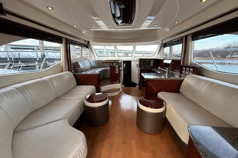  Yacht Photos Pics Luxurious interior of a 2008 Sea Ray 52 Sedan Bridge yacht with modern furnishings.