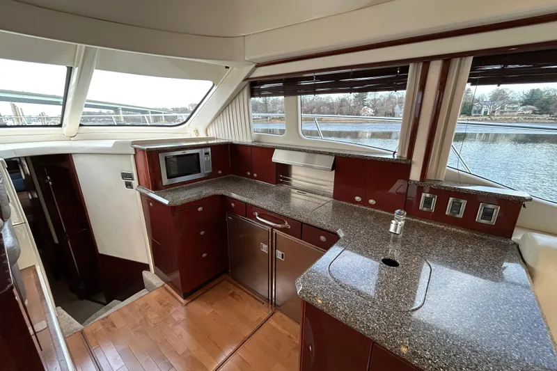  Yacht Photos Pics Luxurious 2008 Sea Ray 52 Sedan Bridge yacht interior with modern kitchen amenities.