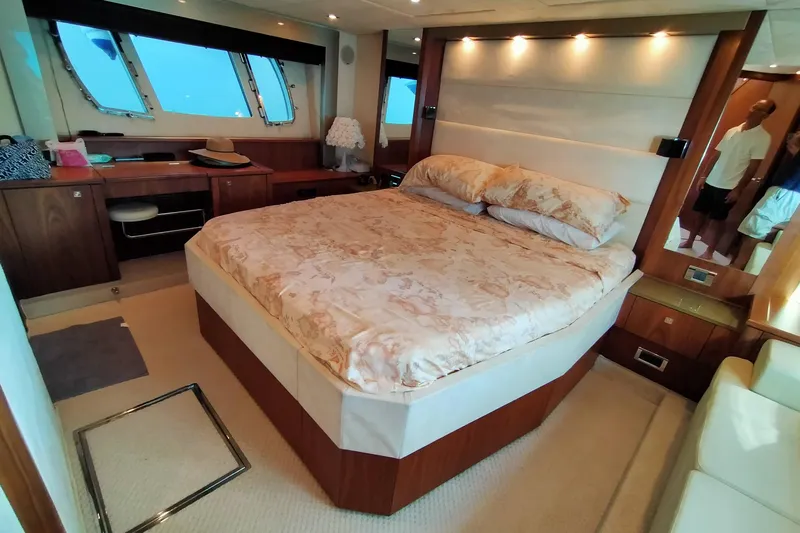  Yacht Photos Pics Luxurious bedroom interior of 2009 Sunseeker Predator 64 yacht with elegant furnishings.