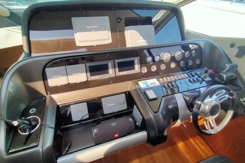  Yacht Photos Pics Control panel of 2009 Sunseeker Predator 64 yacht with Raymarine navigation equipment.