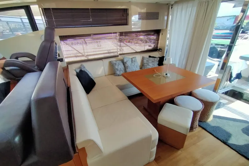  Yacht Photos Pics Luxurious interior of 2009 Sunseeker Predator 64 yacht with elegant seating and dining area.